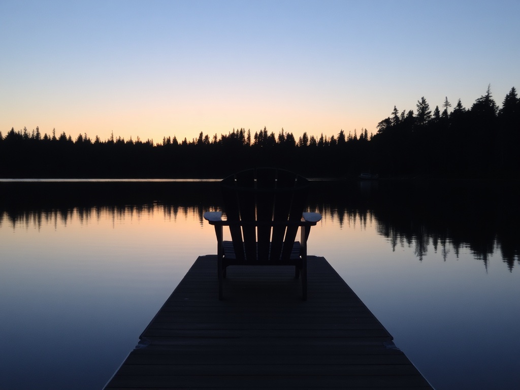 quiet dock chair sunset Lake of the Woods calm evening Kenora