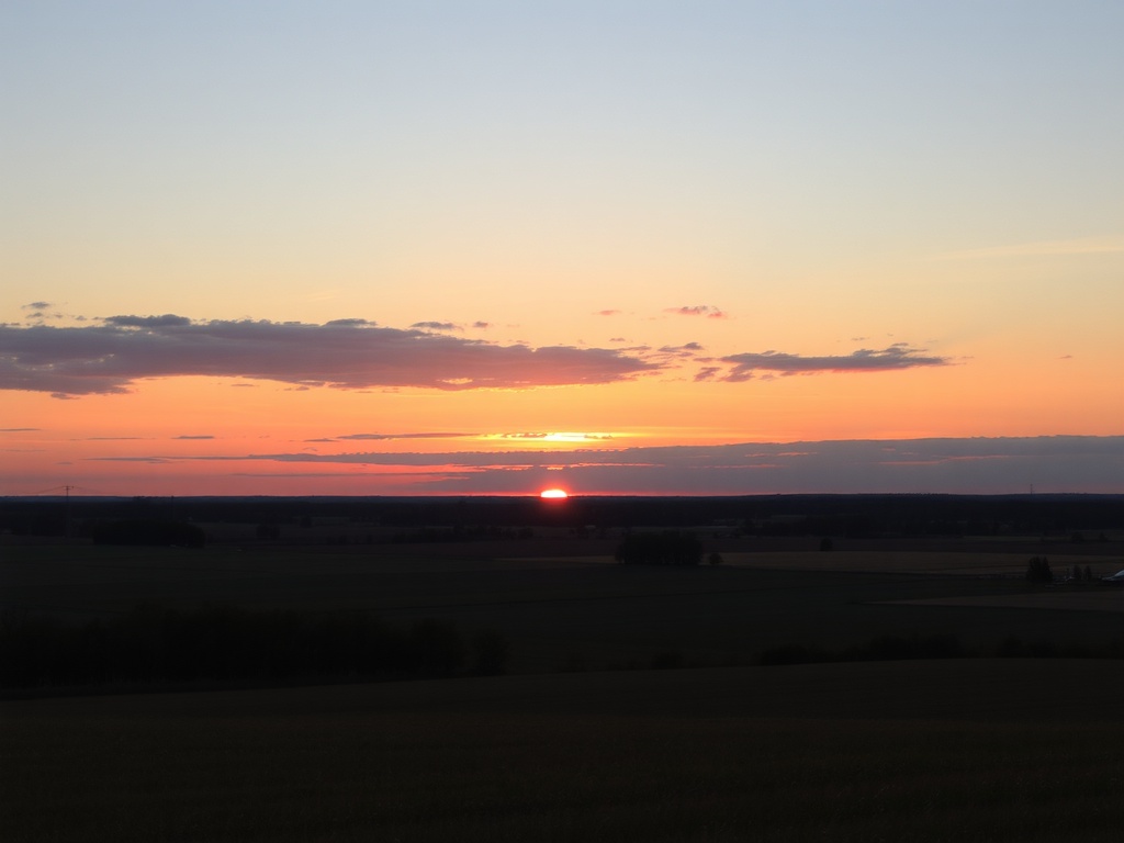 Ontario sunset over fields with warm colors and peaceful rural setting