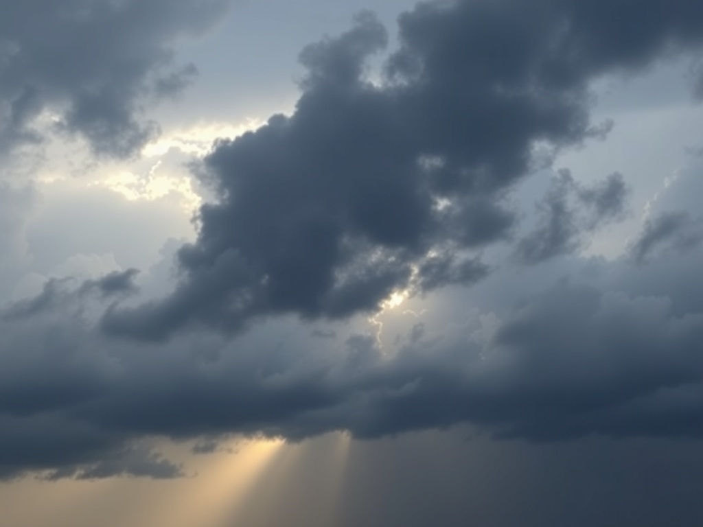 storm calming slightly, dark clouds parting with light emerging