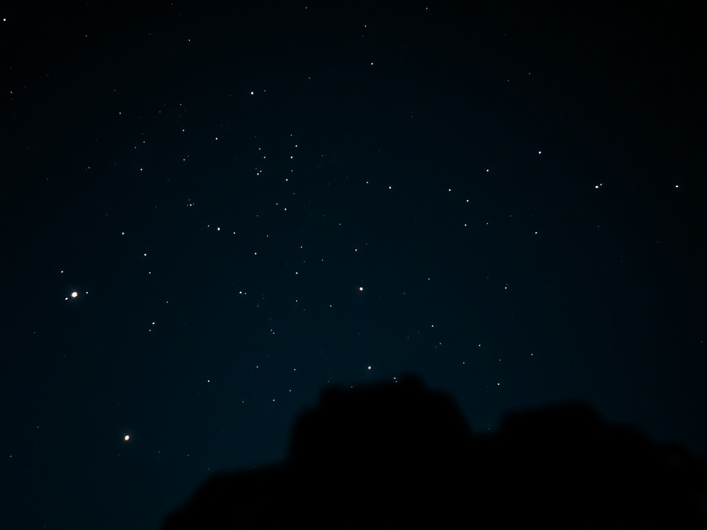 A camera with a wide-open aperture, capturing the glow of the stars in a dark, clear sky.