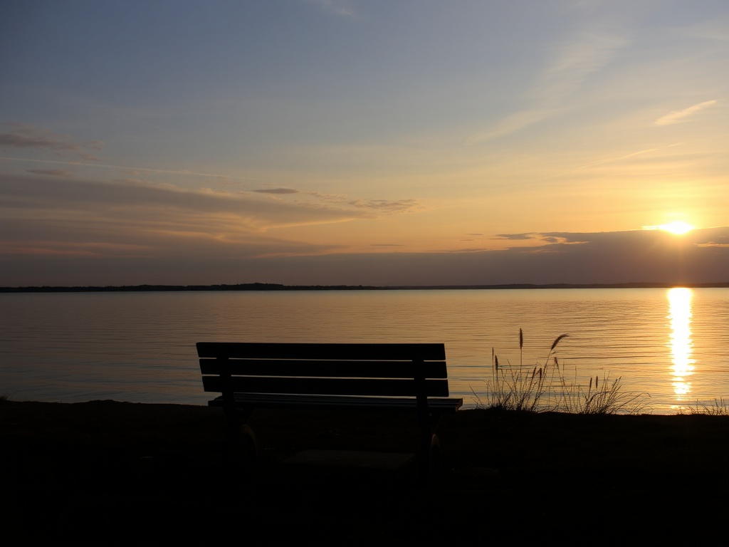 Whitby sunrise lake Ontario golden light peaceful shoreline empty bench calm reflective scene